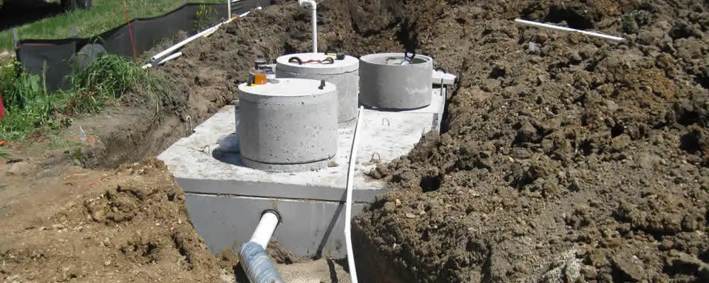 Septic system repair and installation site with tank access ports in Concord, MA